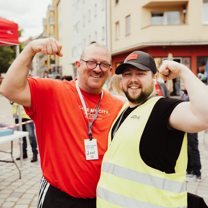 Two men showing off their muscles