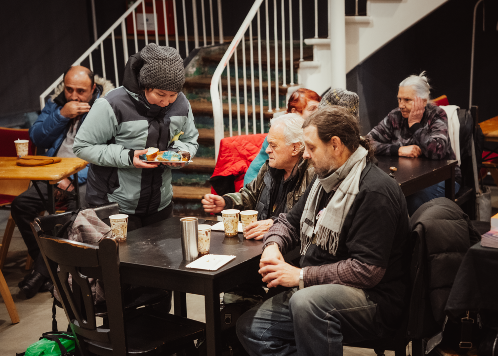 Some people sit together and drink tea &amp; coffee