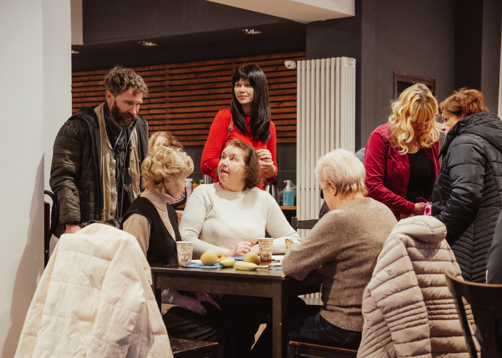 Community where a few people sit around the table